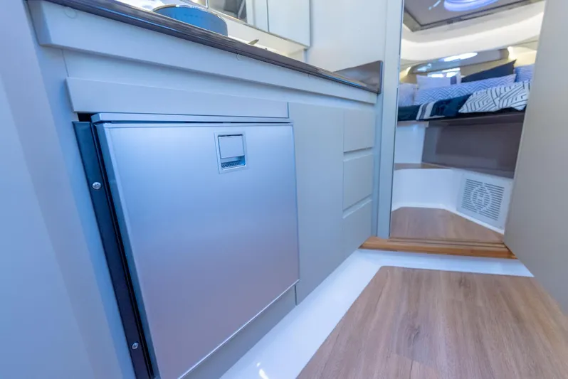 Custom Order Your 415 Today! Yacht Photos Pics Modern interior of Hanover 415 yacht, featuring sleek cabinetry and cozy sleeping area, 2025 model.