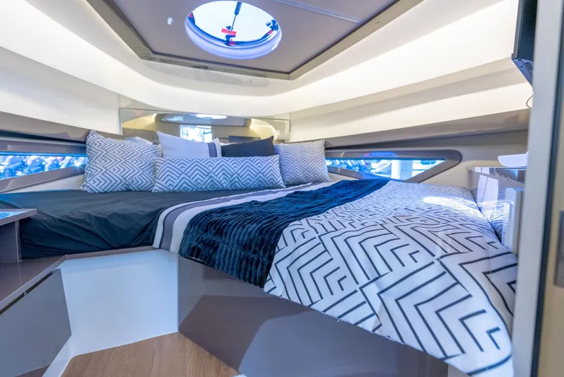 Custom Order Your 415 Today! Yacht Photos Pics Luxurious interior of 2025 Hanover 415 yacht with modern bedding and sleek design.