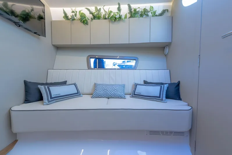 Custom Order Your 415 Today! Yacht Photos Pics Luxurious interior of 2025 Hanover 415 yacht with modern seating and decorative plants.