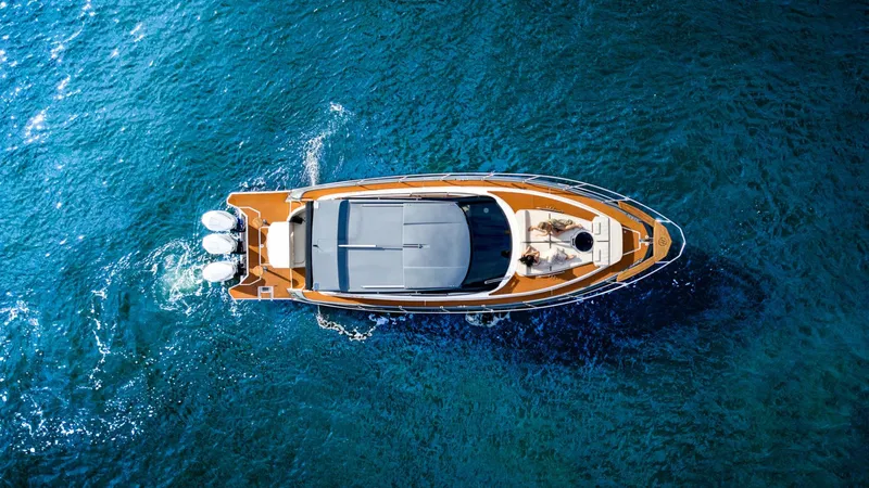 Custom Order Your 415 Today! Yacht Photos Pics Aerial view of 2025 Hanover 415 yacht cruising on blue ocean waters.