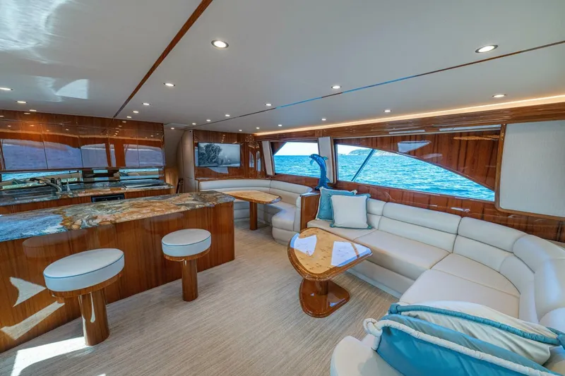 Watts Up Yacht Photos Pics Luxurious interior of 2016 Viking 66 Convertible yacht with elegant seating and ocean view.