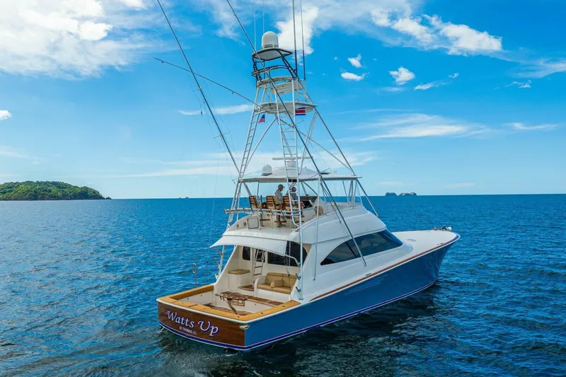 Watts Up Yacht Photos Pics 2016 Viking 66 Convertible yacht cruising on open sea under clear blue sky.
