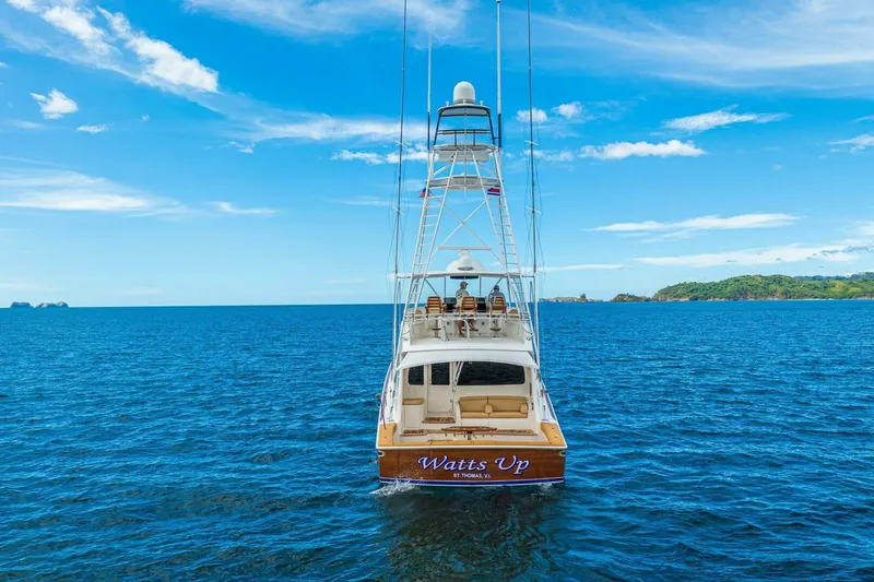 Watts Up Yacht Photos Pics 2016 Viking 66 Convertible yacht "Watts Up" on open sea under clear blue sky.