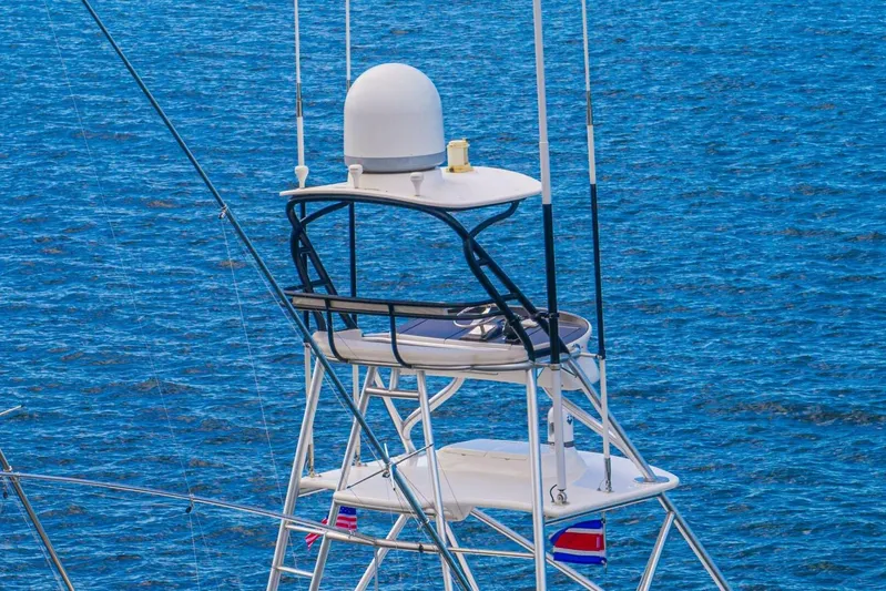 Watts Up Yacht Photos Pics Tower of 2016 Viking 66 Convertible yacht against blue ocean backdrop.