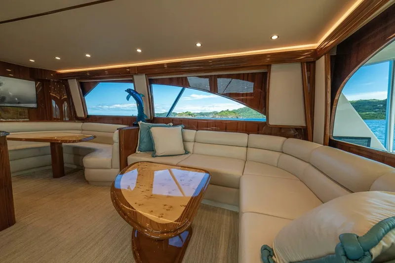 Watts Up Yacht Photos Pics Luxurious interior of 2016 Viking 66 Convertible yacht with elegant seating and scenic views.