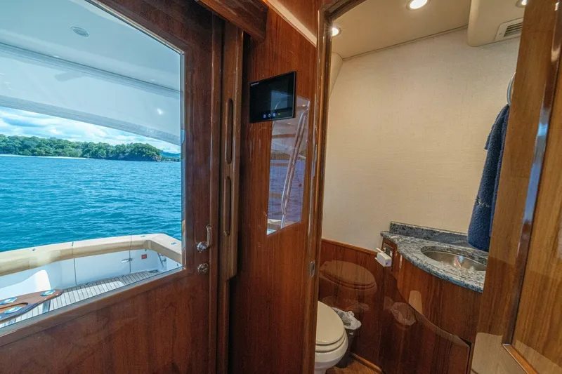 Watts Up Yacht Photos Pics 2016 Viking 66 Convertible yacht interior with bathroom and ocean view.