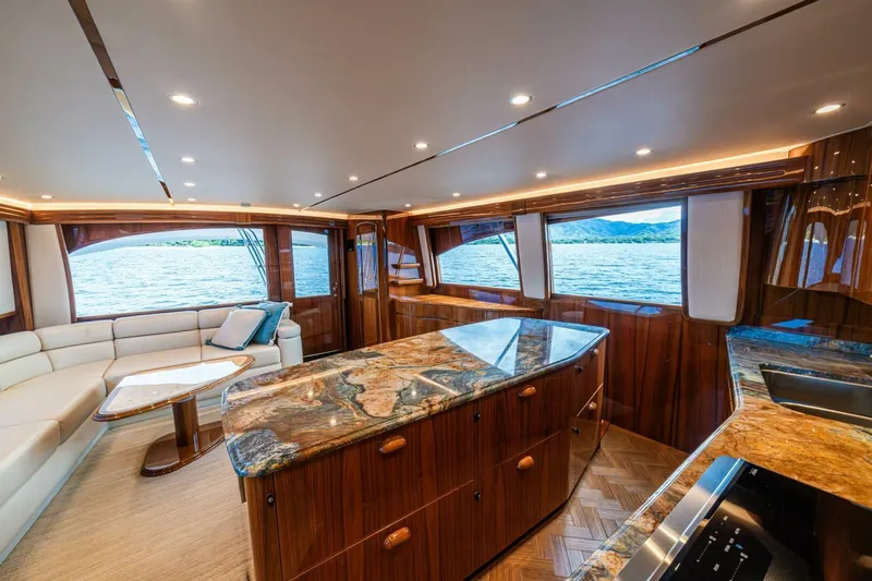 Watts Up Yacht Photos Pics Luxurious interior of 2016 Viking 66 Convertible yacht with elegant wood finishes and scenic views.