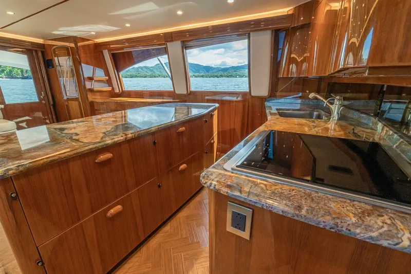 Watts Up Yacht Photos Pics Luxurious interior of 2016 Viking 66 Convertible yacht with elegant wood and marble finishes.
