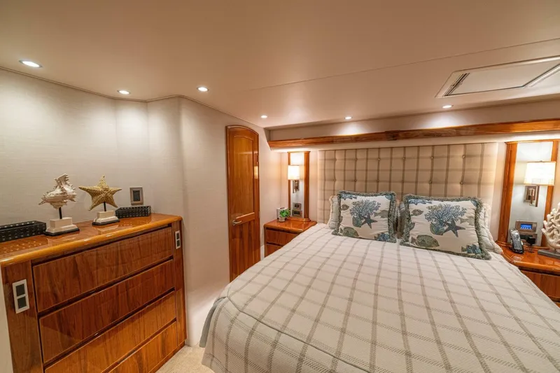 Watts Up Yacht Photos Pics Luxurious bedroom interior of 2016 Viking 66 Convertible yacht with elegant decor.
