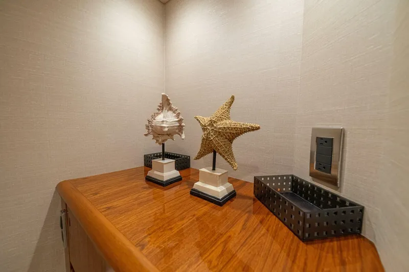 Watts Up Yacht Photos Pics Decorative seashells on wooden surface inside 2016 Viking 66 Convertible yacht interior.