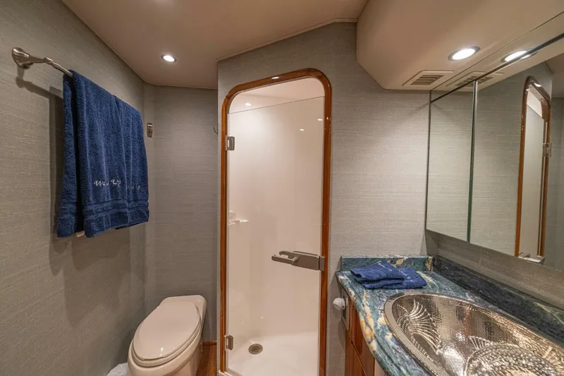 Watts Up Yacht Photos Pics Luxurious bathroom in 2016 Viking 66 Convertible yacht with modern fixtures and elegant design.