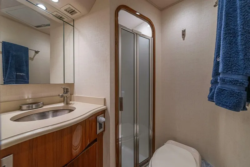 Watts Up Yacht Photos Pics Luxurious bathroom in 2016 Viking 66 Convertible yacht with modern fixtures and shower.