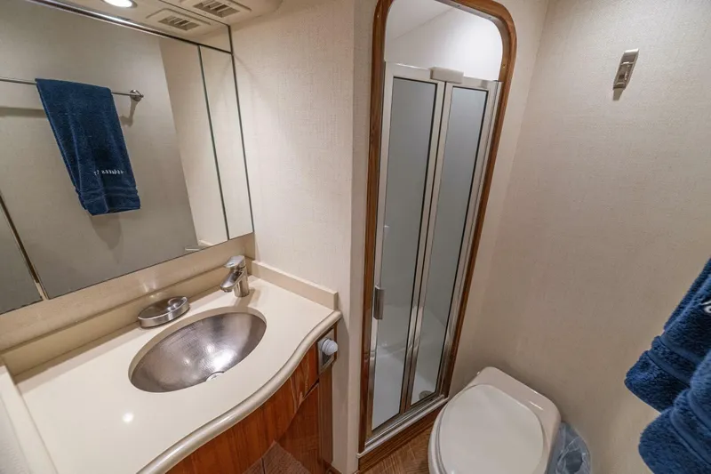 Watts Up Yacht Photos Pics Luxurious bathroom in 2016 Viking 66 Convertible yacht with shower and sink.