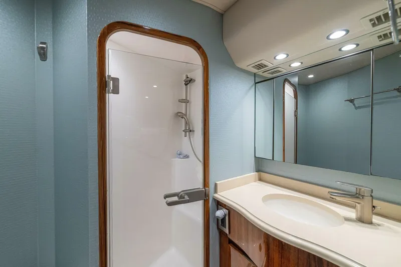 Watts Up Yacht Photos Pics Bathroom interior of 2016 Viking 66 Convertible yacht with shower and vanity.