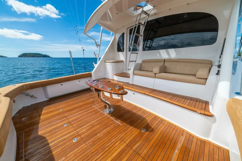 Watts Up Yacht Photos Pics Luxurious 2016 Viking 66 Convertible yacht deck with seating, ocean view, and clear skies.