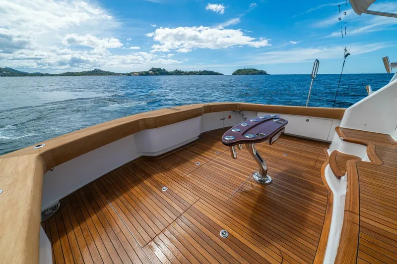 Watts Up Yacht Photos Pics Luxurious 2016 Viking 66 Convertible yacht deck with ocean view and clear blue sky.