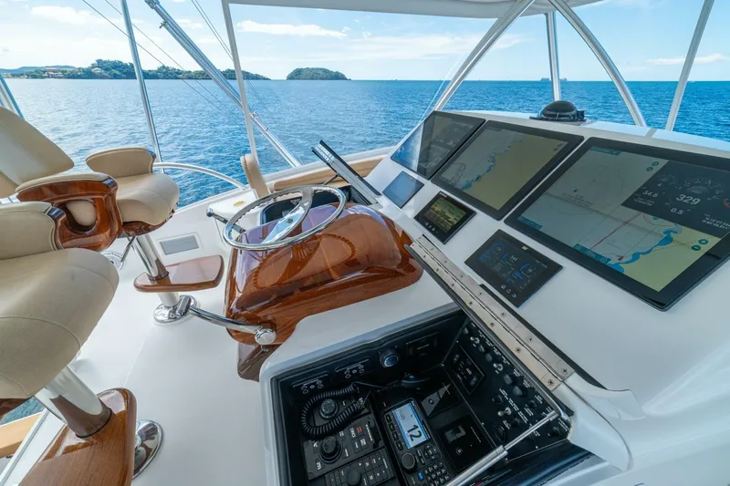 Watts Up Yacht Photos Pics Helm of 2016 Viking 66 Convertible yacht with navigation screens and ocean view.