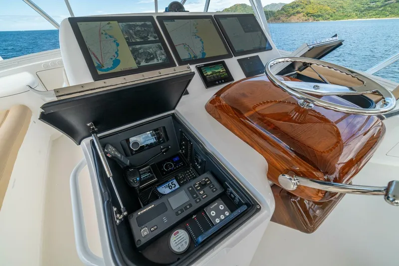 Watts Up Yacht Photos Pics Cockpit of 2016 Viking 66 Convertible yacht with navigation screens and controls.