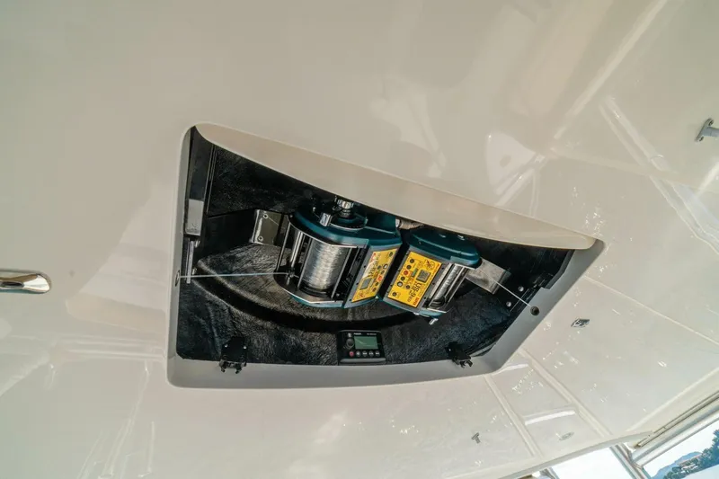 Watts Up Yacht Photos Pics 2016 Viking 66 Convertible yacht equipment compartment with winch and control panel.