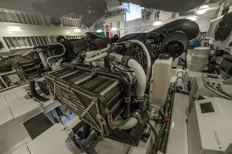 Watts Up Yacht Photos Pics Engine room of 2016 Viking 66 Convertible yacht, showcasing complex machinery and components.