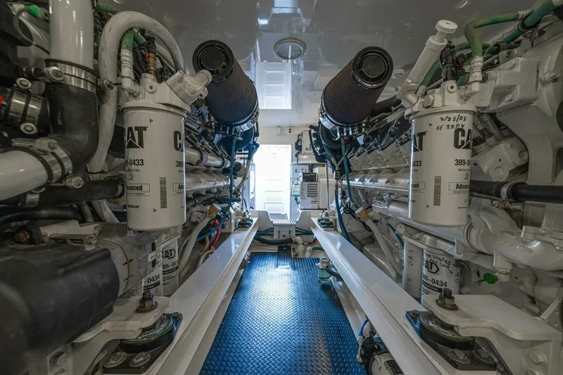 Watts Up Yacht Photos Pics Engine room of a 2016 Viking 66 Convertible yacht, featuring CAT machinery.