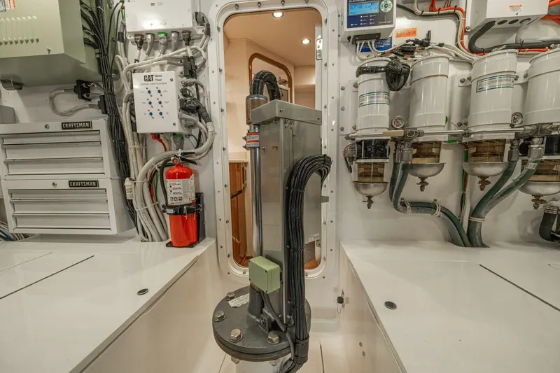 Watts Up Yacht Photos Pics Engine room of 2016 Viking 66 Convertible yacht with equipment and wiring.