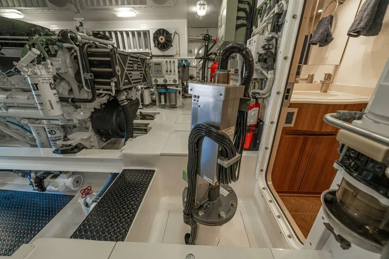 Watts Up Yacht Photos Pics Engine room of 2016 Viking 66 Convertible yacht, showcasing machinery and equipment.