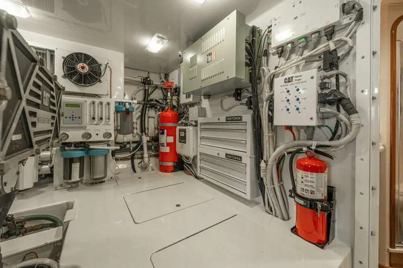 Watts Up Yacht Photos Pics Engine room of 2016 Viking 66 Convertible yacht with equipment and fire safety systems.