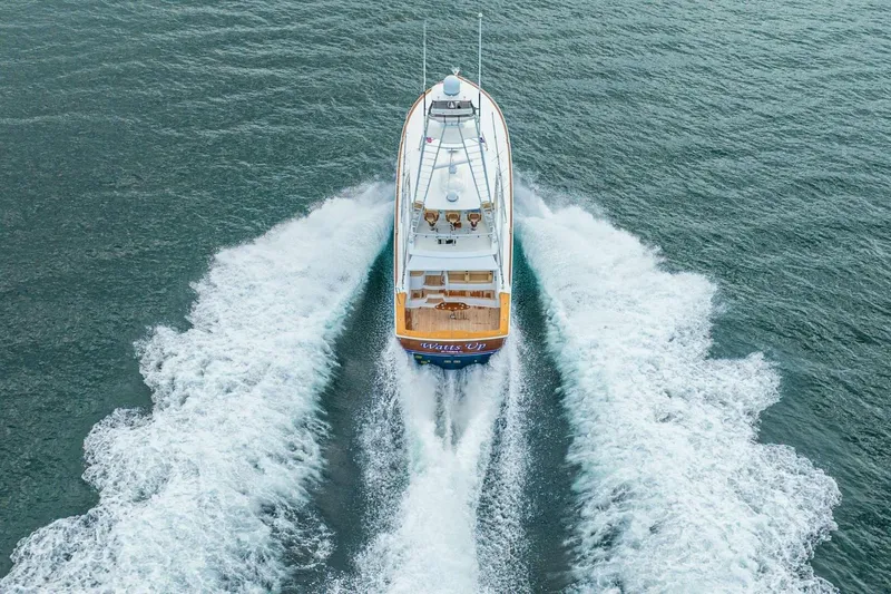 Watts Up Yacht Photos Pics Aerial view of 2016 Viking 66 Convertible yacht cruising on open water.