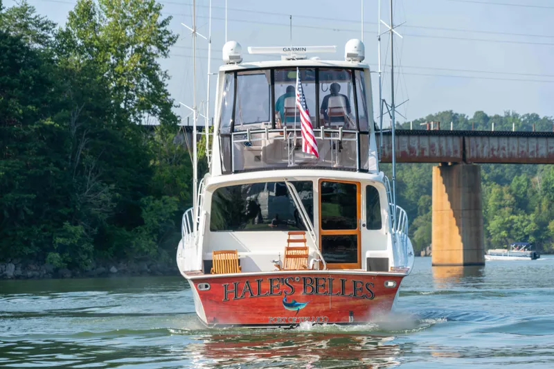  Yacht Photos Pics 1997 Ocean Yachts 60 Sport Fish boat on water, rear view, near bridge.
