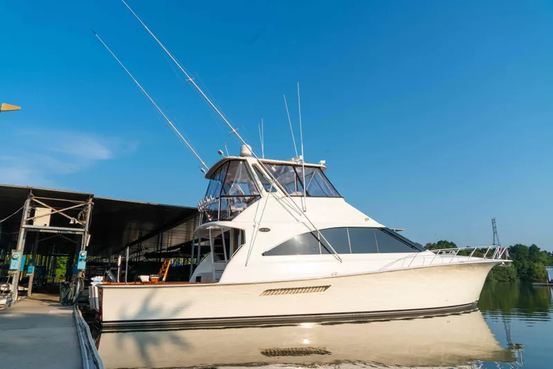  Yacht Photos Pics 1997 Ocean Yachts 60 Sport Fish boat docked under clear blue sky.