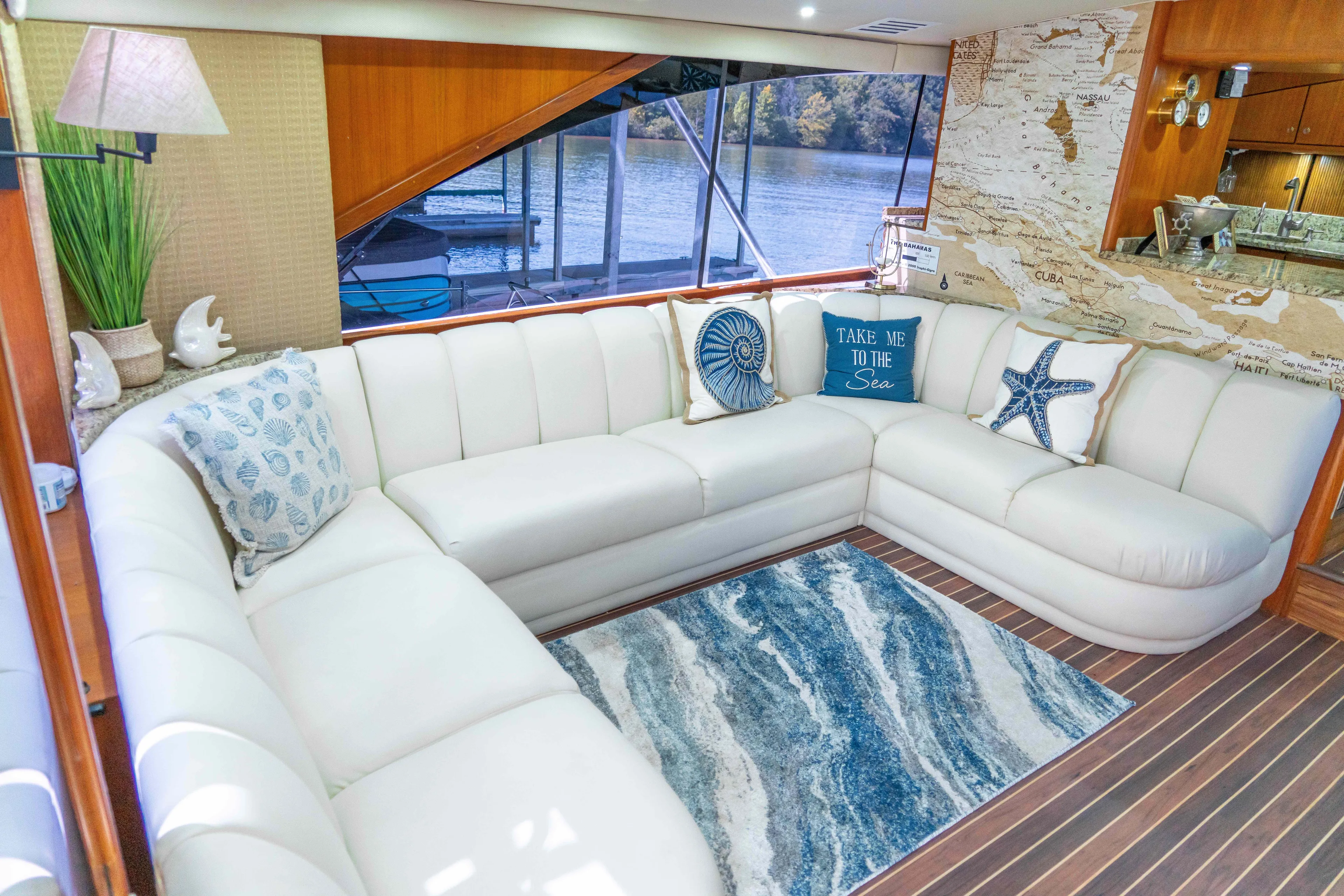  Yacht Photos Pics Luxurious 1997 Ocean Yachts 60 Sport Fish interior with elegant white seating and nautical decor.