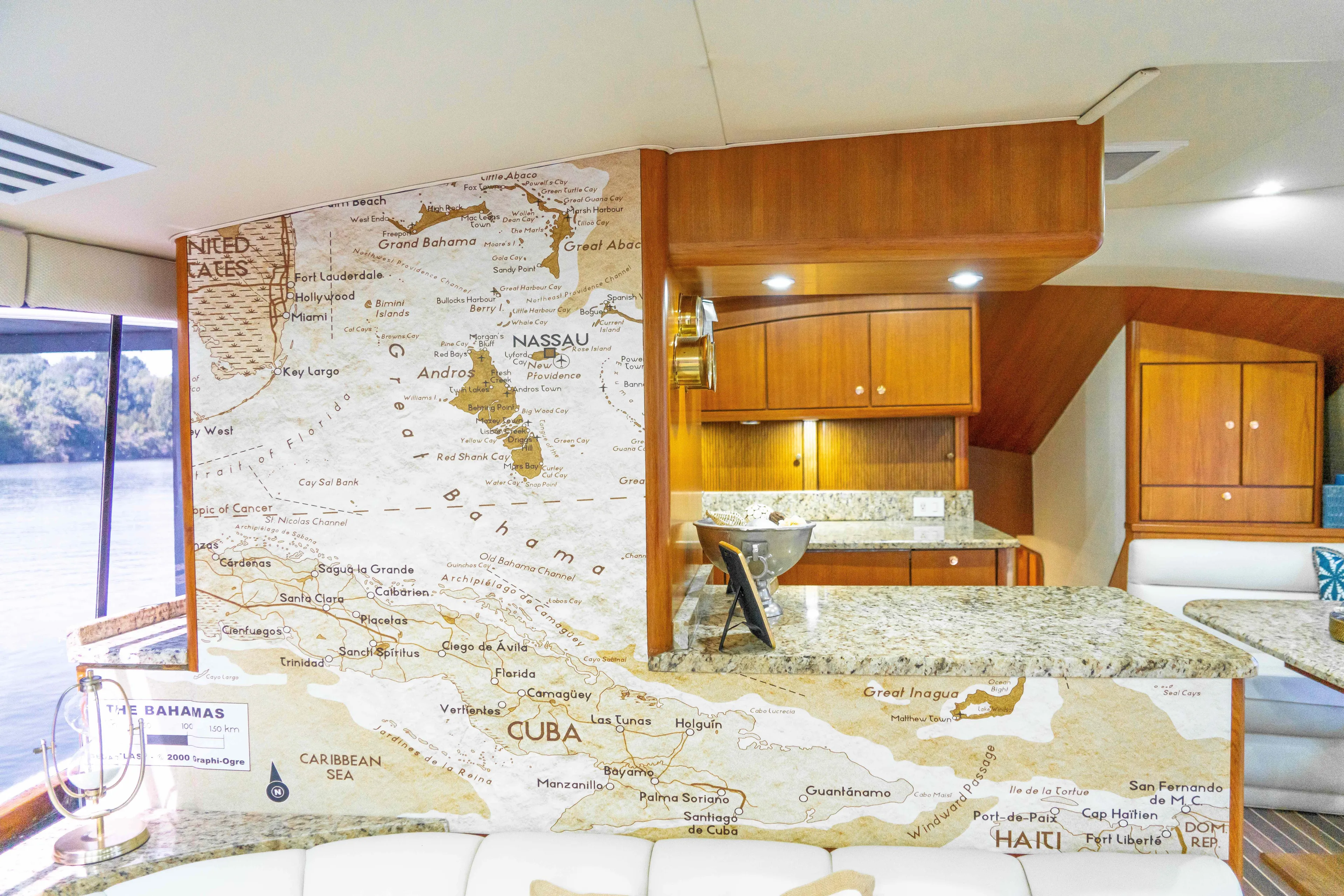  Yacht Photos Pics Interior of 1997 Ocean Yachts 60 Sport Fish with Caribbean map decor and wooden cabinetry.