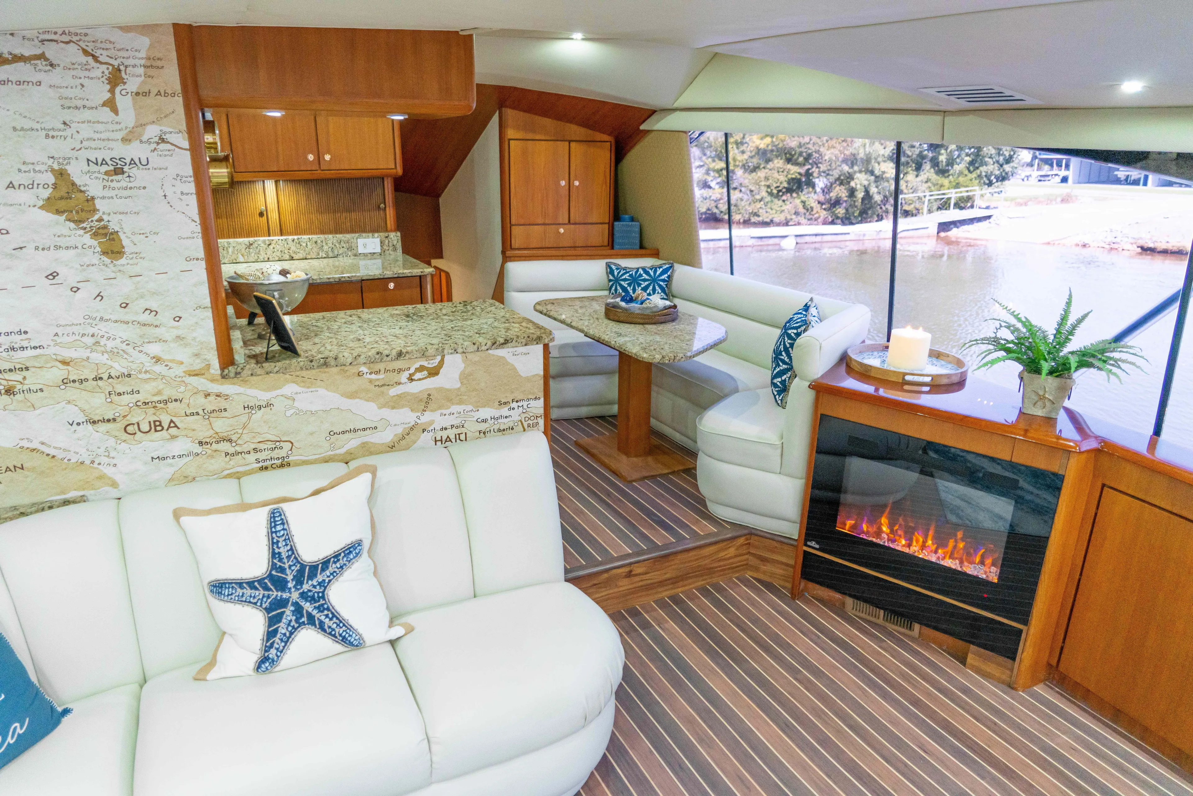  Yacht Photos Pics Luxurious interior of 1997 Ocean Yachts 60 Sport Fish with elegant seating and fireplace.