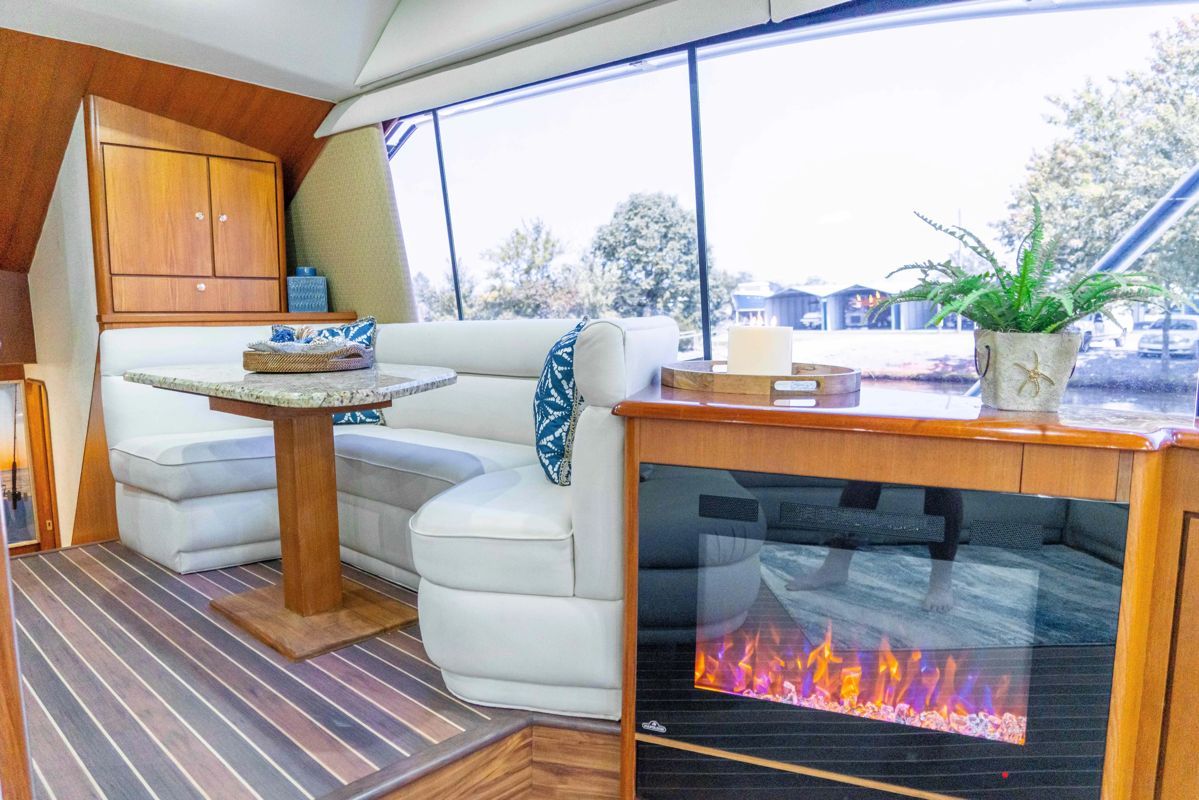  Yacht Photos Pics Luxurious interior of 1997 Ocean Yachts 60 Sport Fish with cozy seating and fireplace.