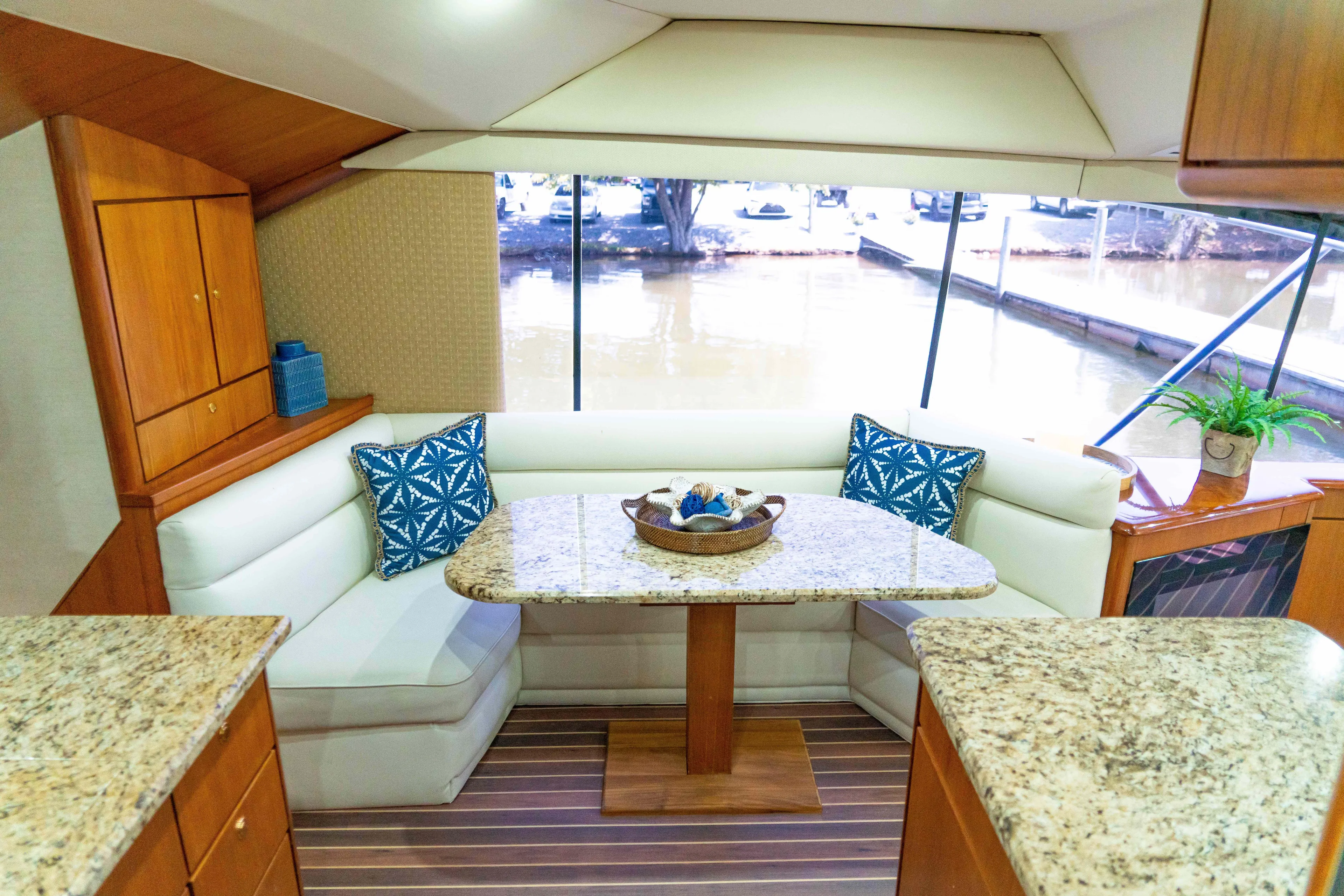  Yacht Photos Pics Interior of 1997 Ocean Yachts 60 Sport Fish with elegant seating and table.