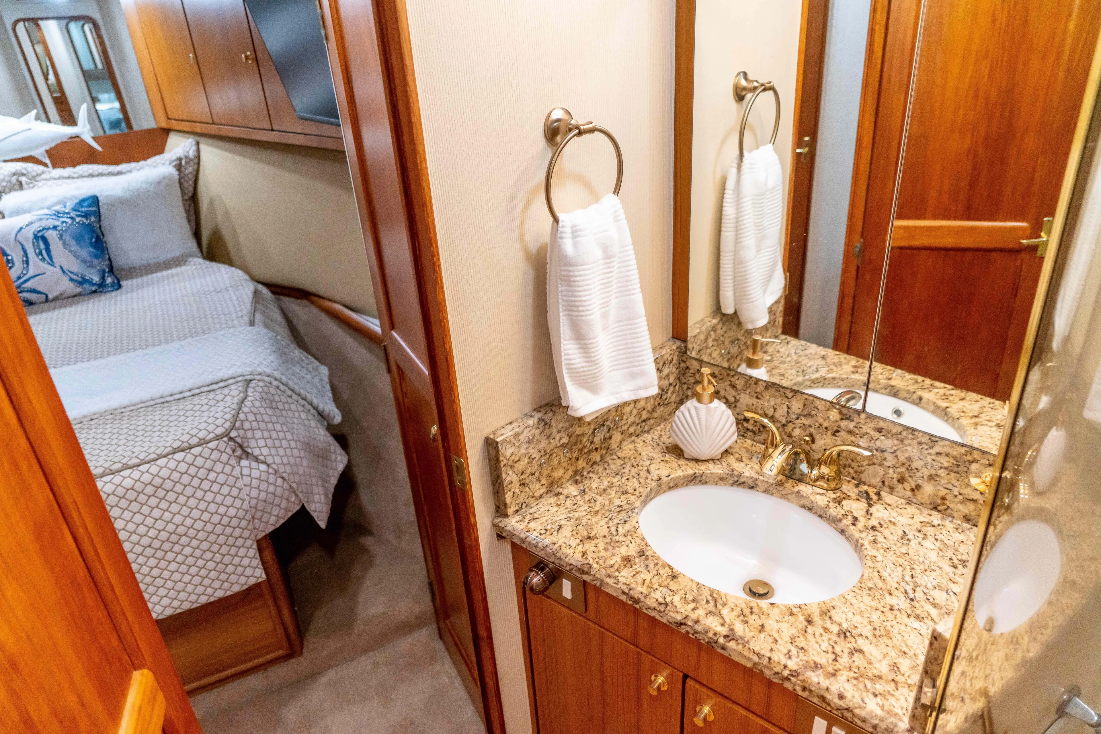  Yacht Photos Pics Luxurious 1997 Ocean Yachts 60 Sport Fish interior with elegant bathroom and cozy bedroom.