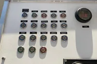 Control panel with labeled buttons and gauge on a Custom Survey 55, 1997 model.