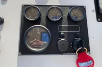Control panel of a 1997 Custom Survey 55 boat with Volvo Penta gauges.