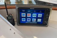 Boat navigation system with Raymarine display and radio, Custom Survey 55, 1997 model.