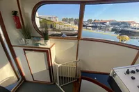 Interior view of a 1997 Custom Survey 55 boat with marina in background.