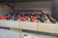Battery bank with red and blue connectors in a Custom Survey 55, 1997 model.