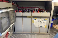 Electrical panel and battery setup in a Custom Survey 55, 1997 model.