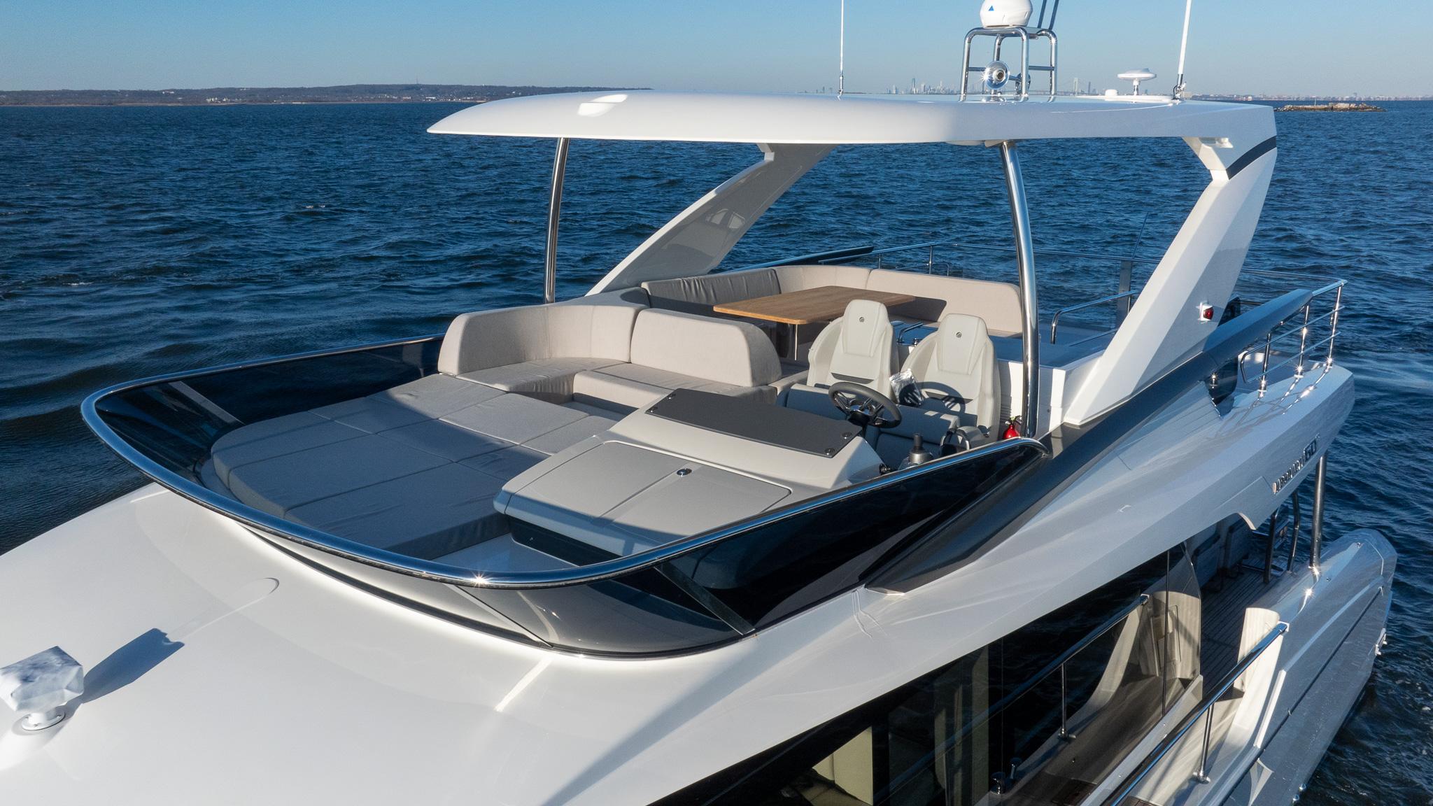 2025 Absolute 60 Fly yacht with spacious flybridge on open water.