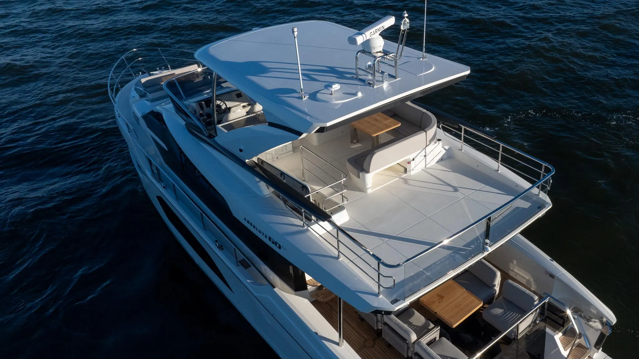 Luxury 2025 Absolute 60 Fly yacht cruising on open water.