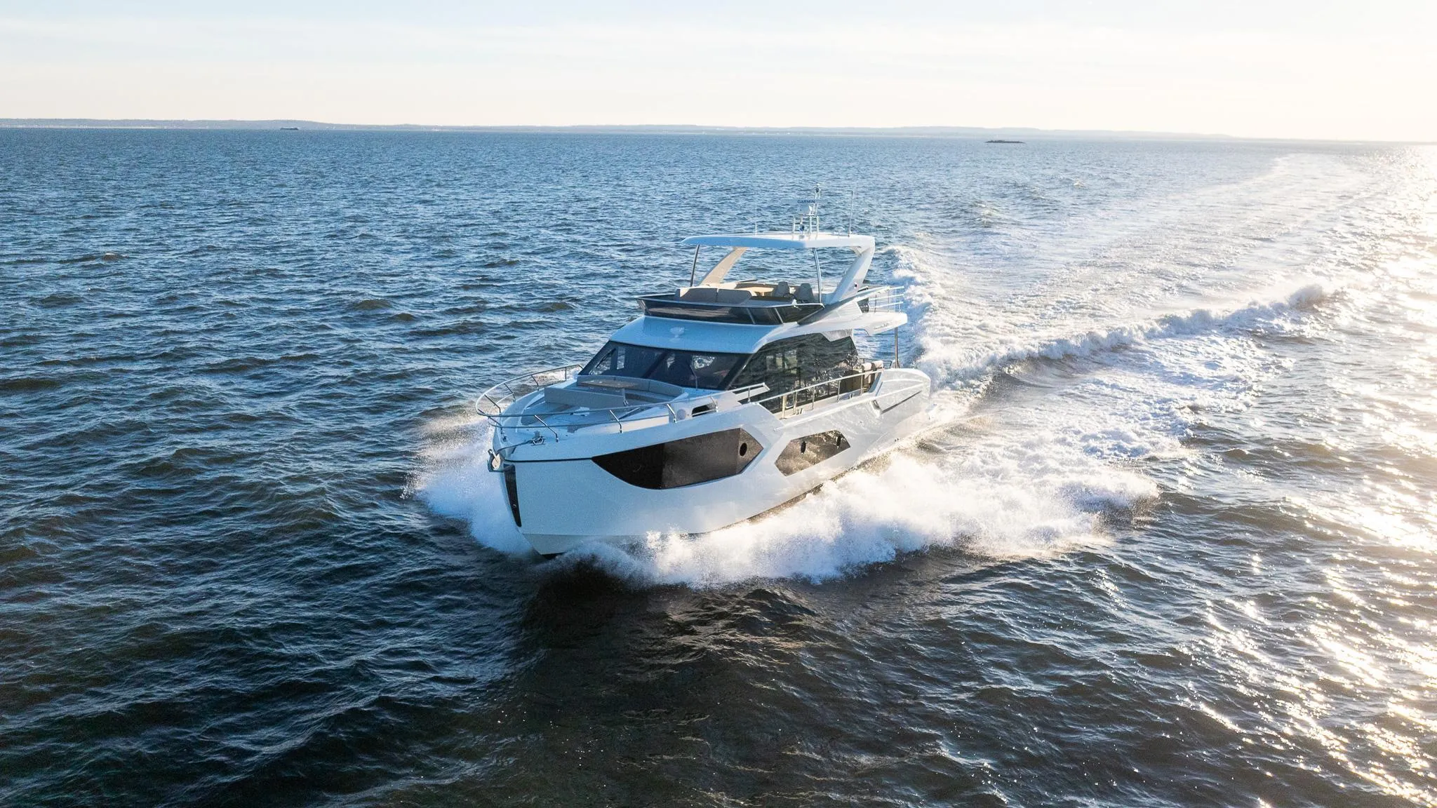 2025 Absolute 60 Fly yacht cruising on open water, showcasing sleek design and performance.