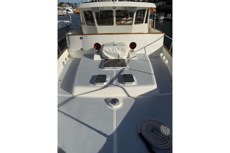 Blue Yacht Photos Pics 1989 Nordhavn 46 yacht deck with coiled rope and cabin view.