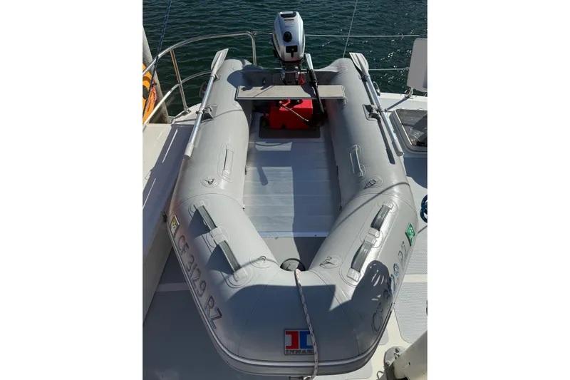 Blue Yacht Photos Pics Inflatable dinghy on 1989 Nordhavn 46 yacht, equipped with an outboard motor.