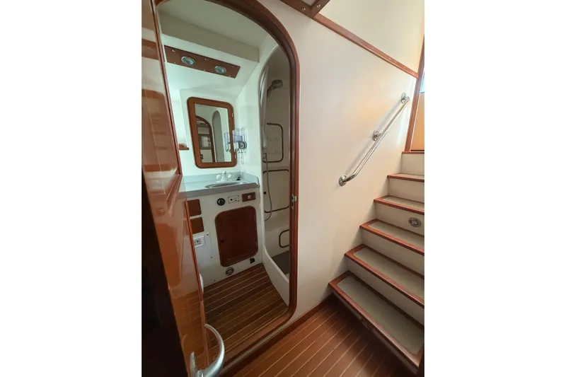 Blue Yacht Photos Pics Interior of 1989 Nordhavn 46 yacht, featuring a bathroom and staircase.