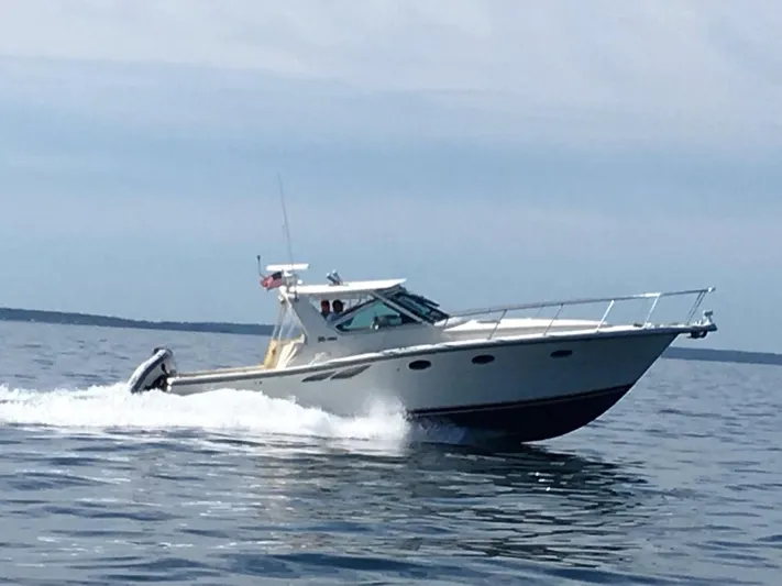 "moxie" Yacht Photos Pics 1998 Tiara Yachts 35 Open Hardtop cruising on open water.